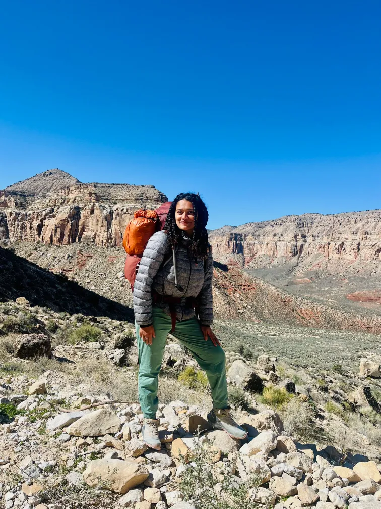 Nomad hiking in mountain landscapes with backpack