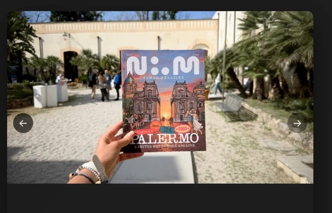 Nomad Magazine Vol. 4 Palermo cover held up in a sunny courtyard in Palermo, Italy