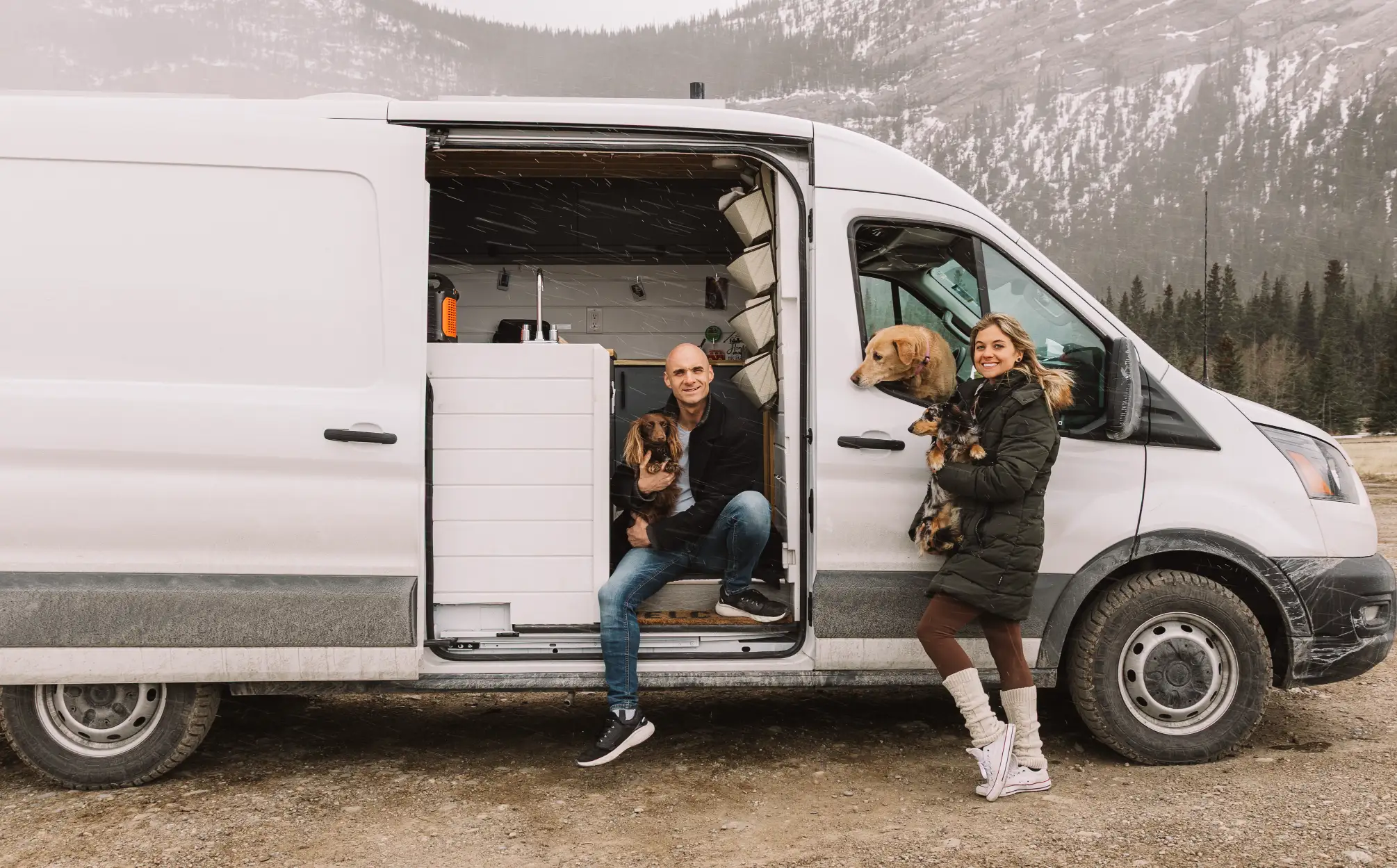 Couple with dogs in a camper van — vanlife photo essay in Nomad Magazine Edition Four