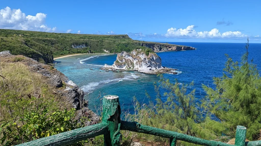 Bird Island limestone islet and rugged volcanic coastline, Saipan