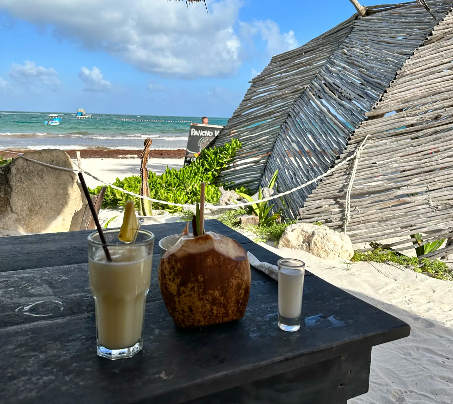 Beautiful Tulum beach with turquoise waters and palm trees