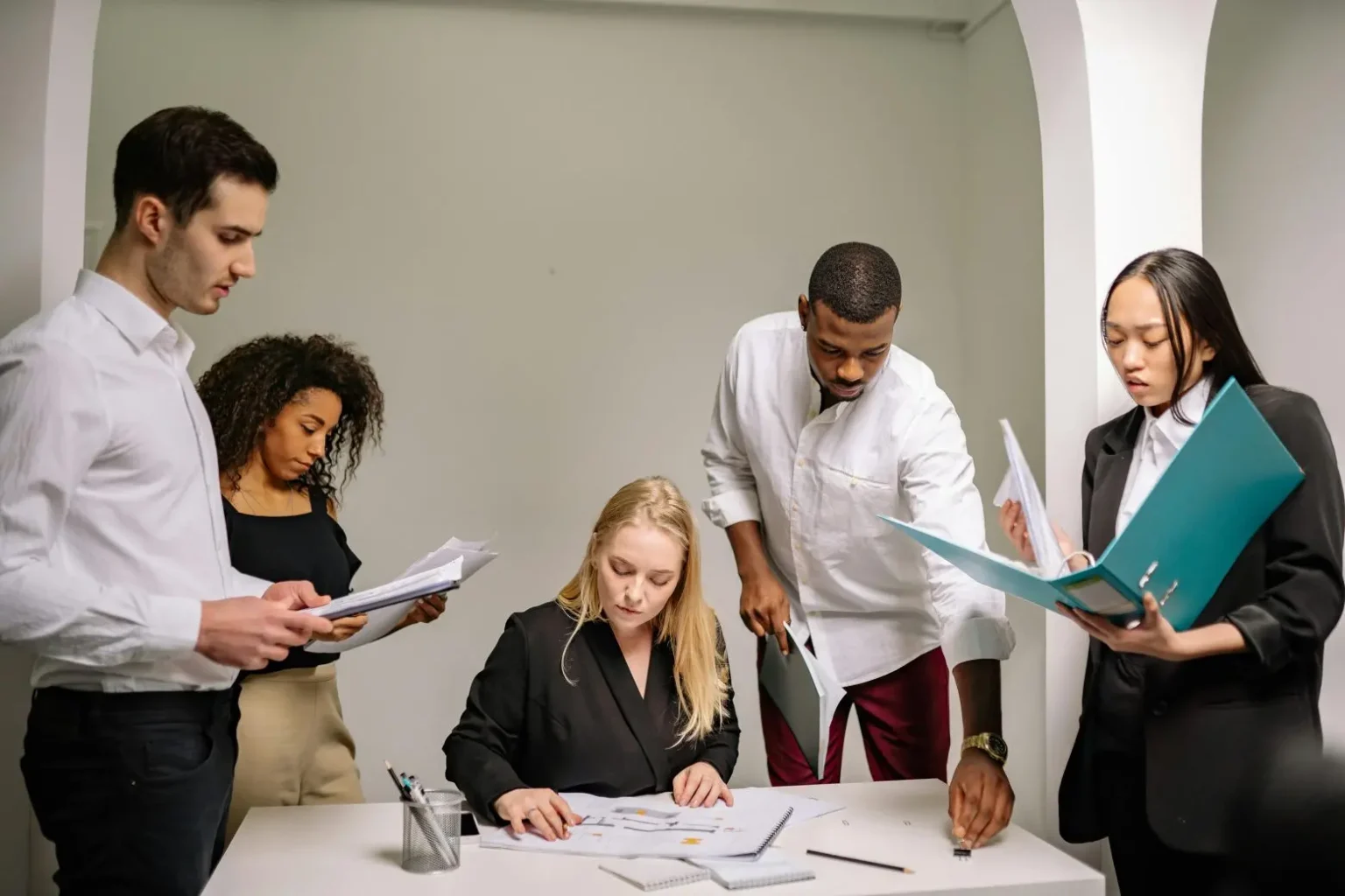 Tax professionals reviewing documents together at a desk